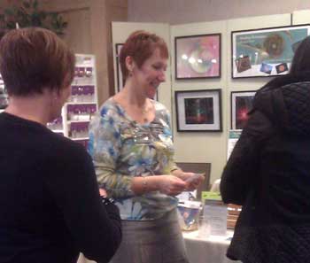 Kristi Borst providing a mini-session to a client at a recent spiritual metaphysical expo